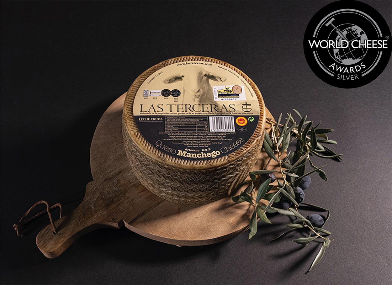 Medalla de plata al queso manchego curado artesano DOP en la categoría de queso Manchego con denominación de origen protegida.